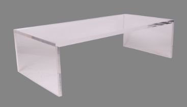 A modern design clear Carew Jones Blade acrylic coffee table, 140 by 70 by 40cms high. Condition