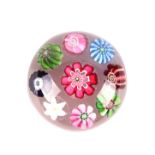 A miniature Clichy paperweight with floral canes, approx 4.5cms diameter. Condition Report In good