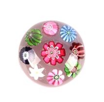 A miniature Clichy paperweight with floral canes, approx 4.5cms diameter. Condition Report In good