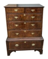 A 19th century chest, the upper section with an arrangement of two short and three graduated long