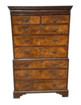 An 18th century style walnut veneered tallboy with moulded cornice above two short and six long