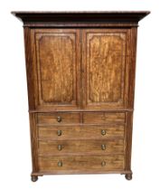 A 19th century mahogany linen press, the upper section with a moulded cornice above twin fielded