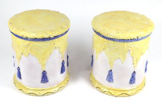 A pair of glazed pottery garden seats of cylindrical form, 44cms high, 38cms diameter (2).