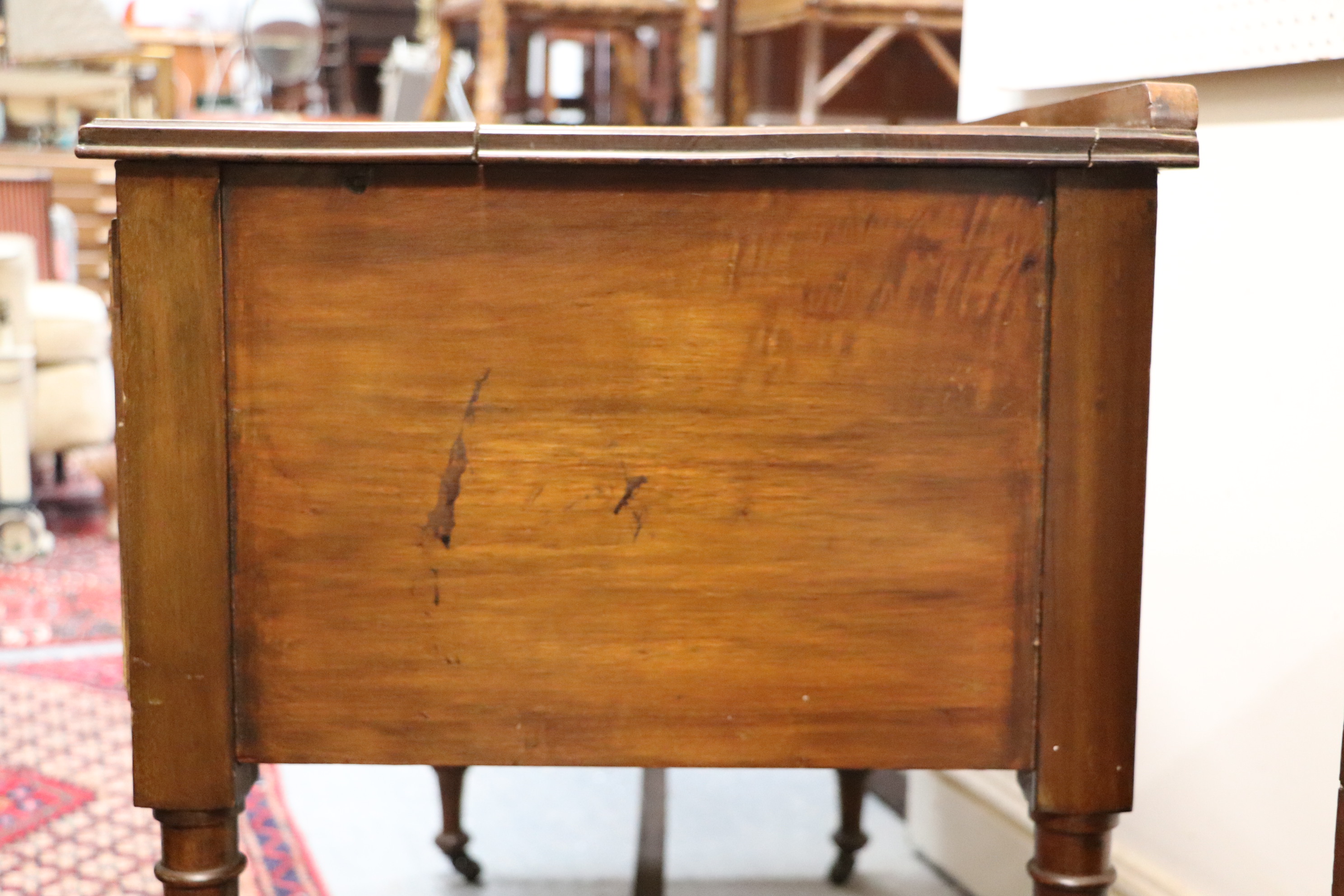 An Edwardian walnut dressing table with an arrangement of three drawers, on reeded tapering legs, - Image 6 of 7