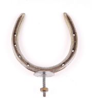 A car accessory mascot in the form of a horseshoe.