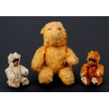 Two Schuco plush articulated monkeys, 6cms high; together with an articulated plush teddy bear,