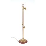 A novelty brass standard lamp, the light fitting incorporating a brass tap fitting, 110cms high.