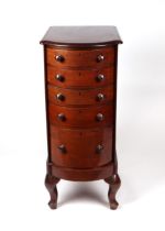 A late 19th century mahogany bowfronted bank of drawers with five graduated drawers, on cabriole