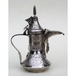 A Turkish / Islamic dallah silver coloured metal coffee pot on stand with presentation