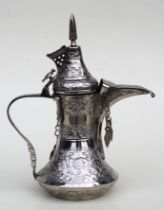 A Turkish / Islamic dallah silver coloured metal coffee pot on stand with presentation