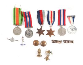 A quantity of assorted militaria to include a Defence medal 39-45 Star, French & German Star,