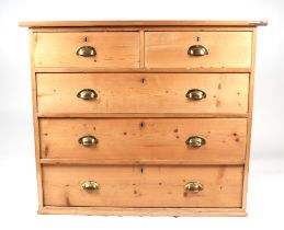 A pine chest of two short and three graduated long drawers, 106cms wide.