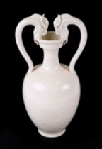 A Chinese two-handled vase with incised decoration, 28cms high.