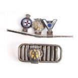 A chrome badge bar with badges to include Royal Yacht Association, the AA and Veteran Motorists 58