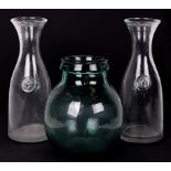 A 1960's Viresa green glass carboy, 24cms high; together with a pair of Italian Svat clear glass 2-