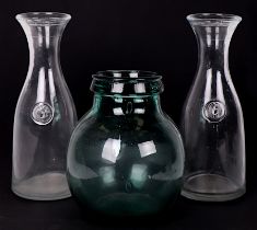 A 1960's Viresa green glass carboy, 24cms high; together with a pair of Italian Svat clear glass 2-