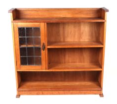 An Arts & Crafts open bookcase, the three-quarter gallery above three open bookshelves and single