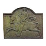 A 17th century style cast iron fire back with a gentleman on horseback; together with a pair of fire