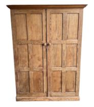 A large North of England School Furnishing Co. Ltd stripped pitch pine school cupboard / larder