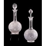 A pair of late 19th century cut glass decanters, 31cms high (one with associated stopper) (2).