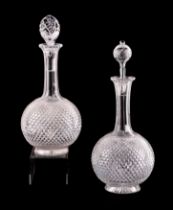 A pair of late 19th century cut glass decanters, 31cms high (one with associated stopper) (2).