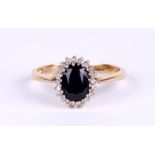 A 9ct gold sapphire and diamond cluster ring, approx UK size 'P', 2g.