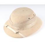 A pith helmet manufactured by Express Yead & Co.