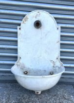 A late Victorian wall mounted water enamel fountain and basin, 42cms wide.