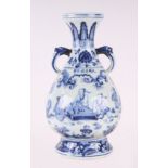 A Chinese blue & white two-handled baluster vase decorated with figures in a landscape, 31cms high.