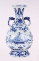 A Chinese blue & white two-handled baluster vase decorated with figures in a landscape, 31cms high.