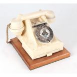 A GPO 328 ivory Bakelite Bell On / Bell Off spin dial telephone with drawer.