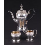 A George V silver three-piece Batchelor tea service with chased decoration, Birmingham 1928, 636g (