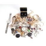 A quantity of assorted costume jewellery to include brooches, bangles, faux pearl necklace,