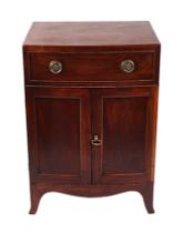 A George VI style mahogany side cabinet, the faux frieze drawer above a pair of panelled doors