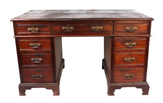 An early 20th century George III style mahogany twin pedestal desk with leather inset top above an
