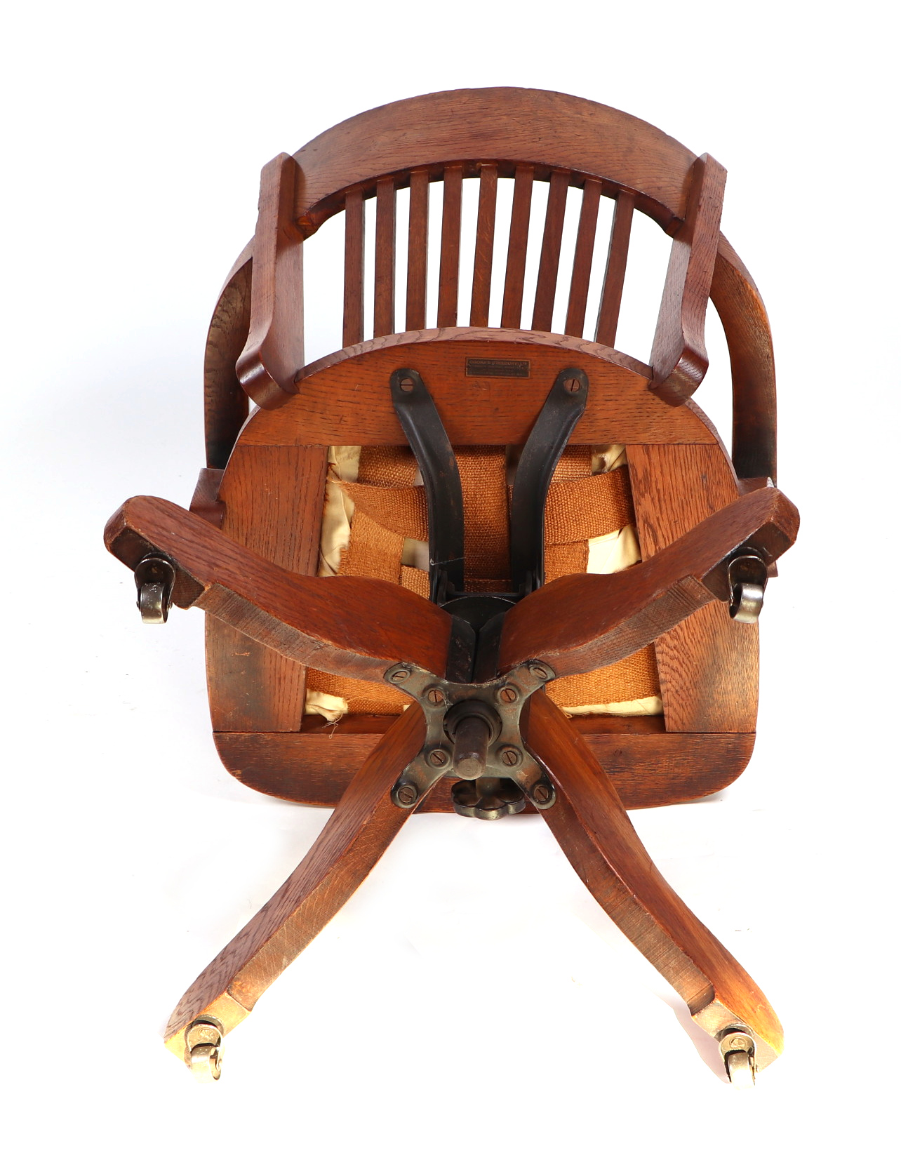 An early 20th century oak revolving desk chair by Cooke's of Finsbury. - Image 3 of 5