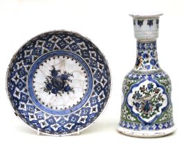 An Iznik pottery vase decorated with birds and foliage, 28cms high; together with a similar bowl