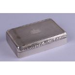 A George V silver snuff box with engine turned decoration, the lid with central vacant cartouche,