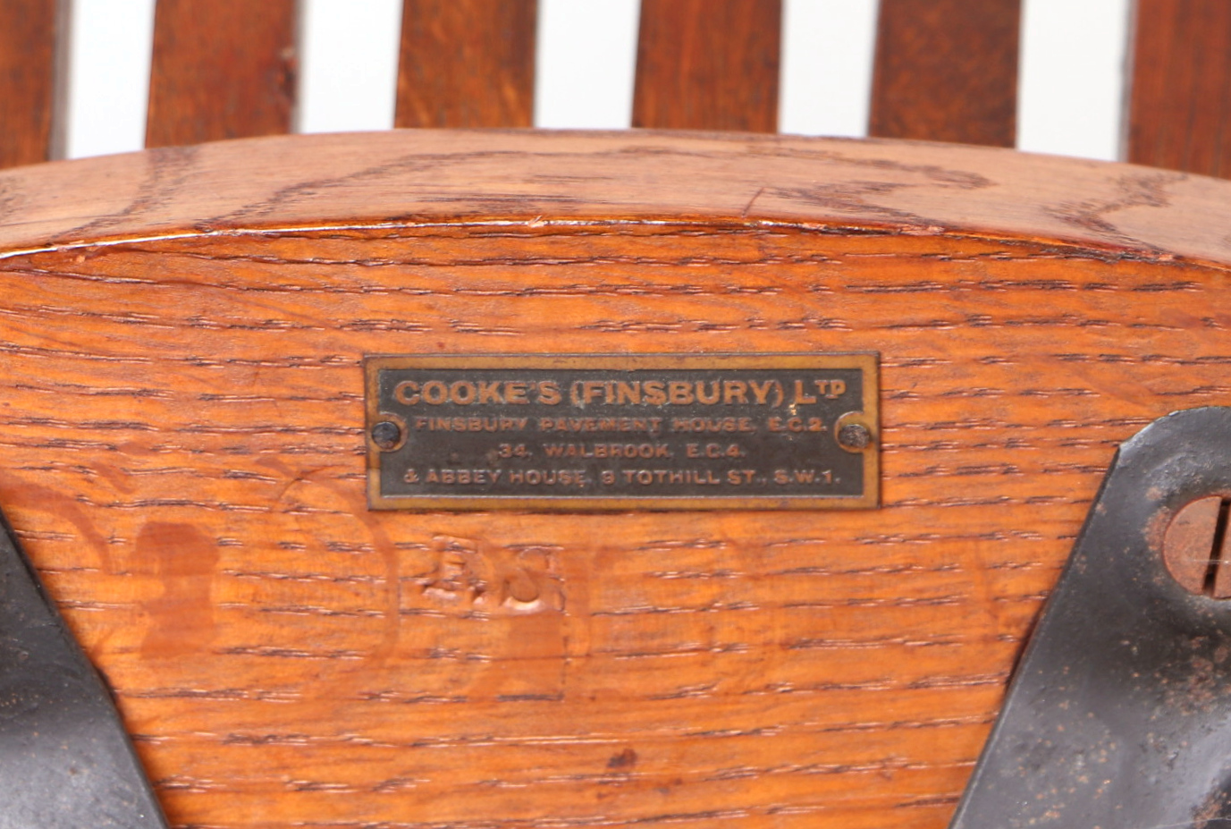 An early 20th century oak revolving desk chair by Cooke's of Finsbury. - Image 2 of 5