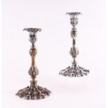 A pair of rococo style silver plated candlesticks, 26cms high (2).