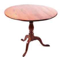 A 19th century mahogany tilt-top tripod table with vase shaped column, 85cms diameter.