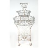 A Victorian style painted wirework four-tier plant stand, approx 115cms high.