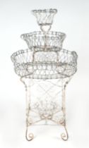 A Victorian style painted wirework four-tier plant stand, approx 115cms high.