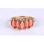 A 9ct gold pink coral dress ring, approx UK size 'P', 2.4g.