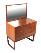 A 20th century design mirror backed dressing chest with three graduated long drawers, 75cms wide.