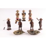 A group of three Chinese soapstone musician figures; together with a group of four carved wooden