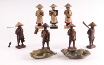 A group of three Chinese soapstone musician figures; together with a group of four carved wooden