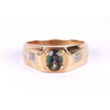 A gentleman's 9ct gold dress ring set with a central oval mystic topaz and diamond set shoulders,