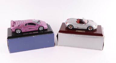 A Gwilo International Ltd 1:18 scale Porsche Boxter, mounted on a plinth, boxed; together with a