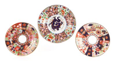 A 19th century Derby plate, 21cms diameter; together with two similar (3). Condition Report The